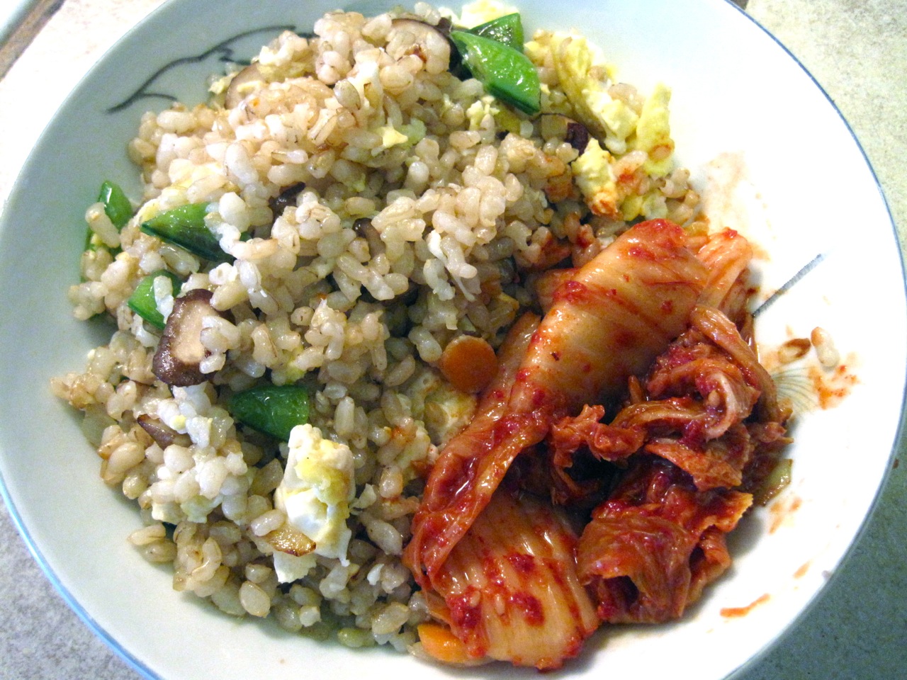 fried brown rice with fresh veggies and kimchi