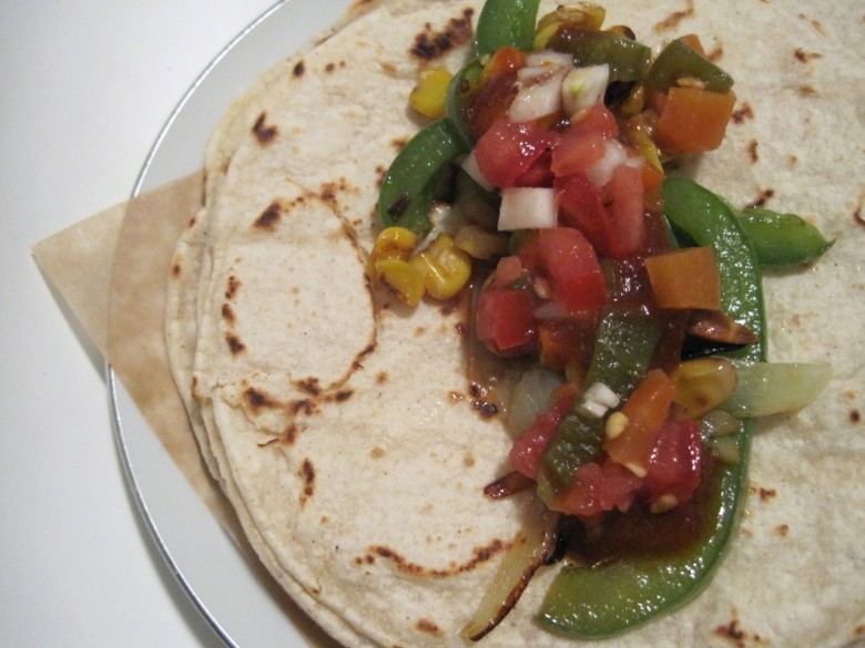 vegetarian taco with pepper onion corn and salsa