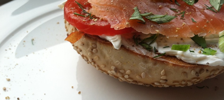 sesame bagel toasted with smoked salmon, tomato, cream cheese and fresh herbs